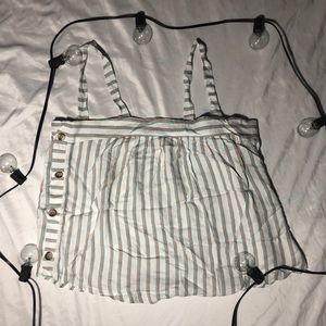 Stripped shirt with buttons on the side.
